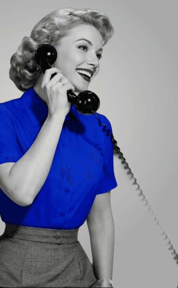 Woman holding a vintage telephone